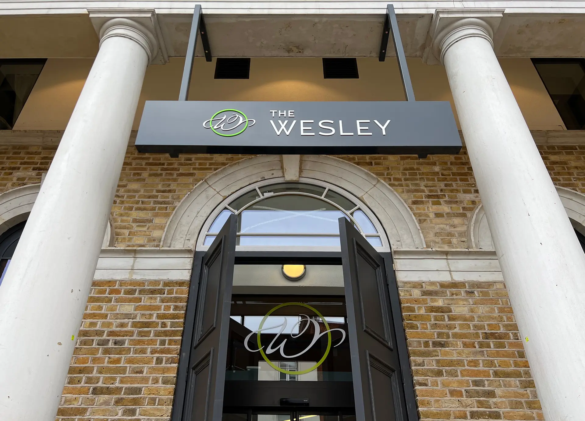 The Wesley Camden hotel exterior with heritage signage designed by Oracle Creative