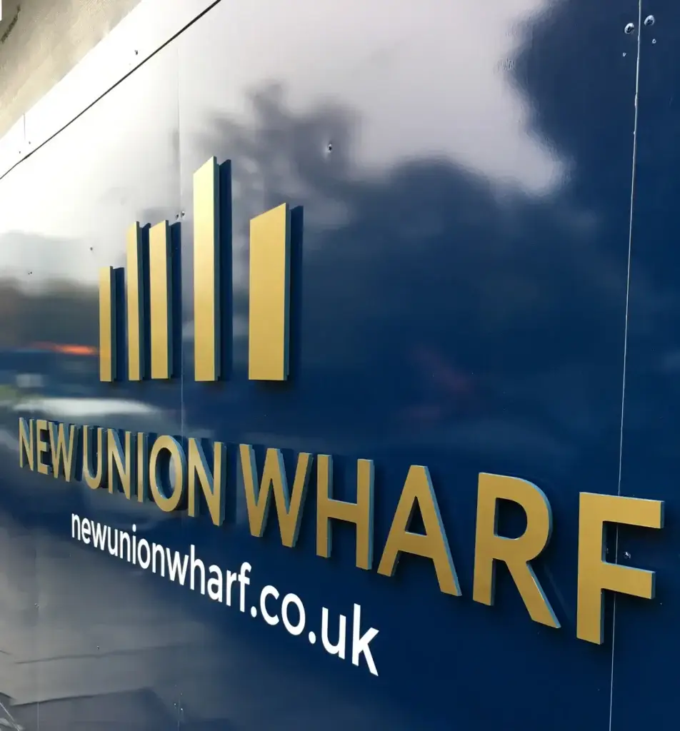 New Union Wharf site hoarding designed by Oracle Creative for L&Q in North Greenwich