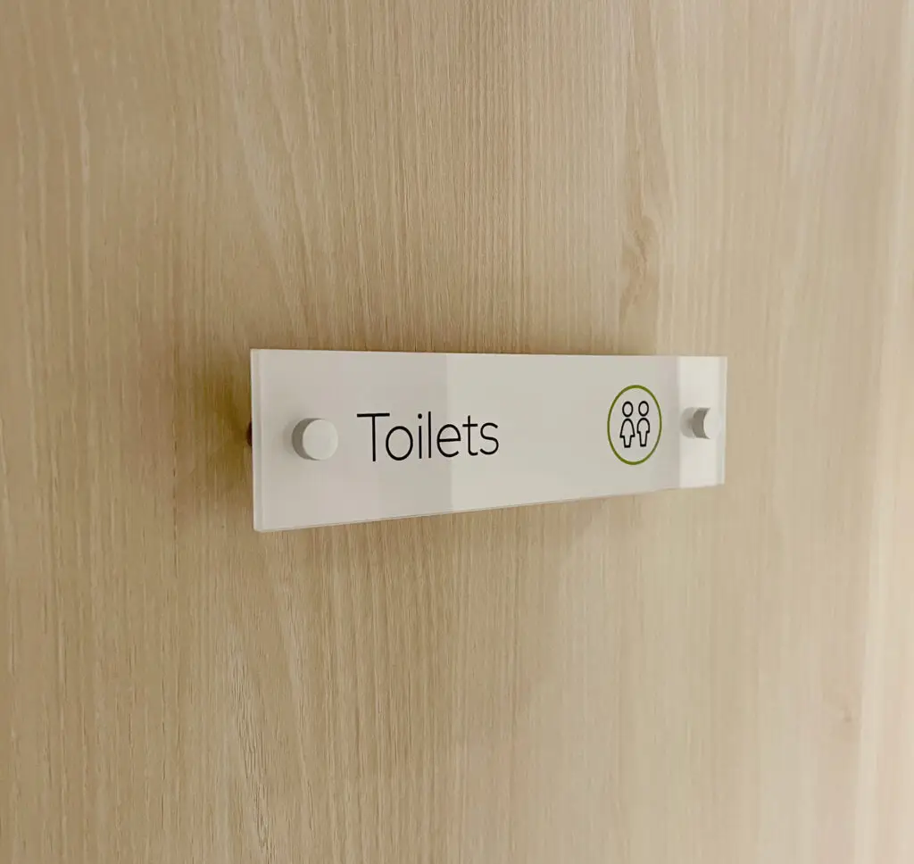 The Wesley Camden interior wayfinding toilet sign designed by Oracle Creative